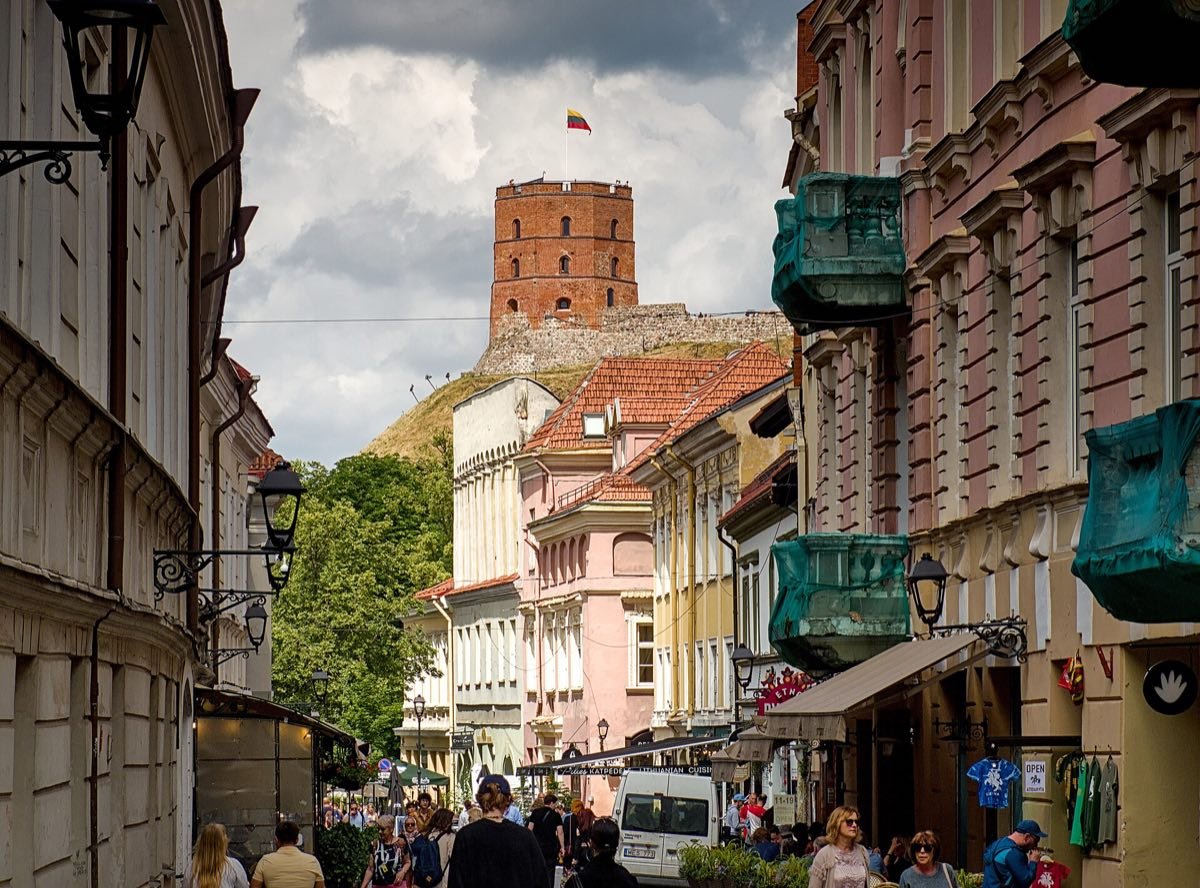 Pilies Street in Vilnius with Gediminas Tower on the hill behind it